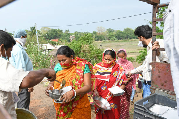 Burdwan, Purba Bardhaman District, West Bengal / India - April 21, 2020: Burdwan's NGO 'Speed' is providing cooked food to people who are unable to make money in the emergence of Novel Coronavirus (COVID-19). At Burdwan, Purba Bardhaman District, West Bengal, India.